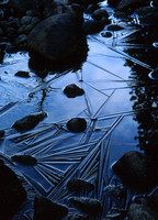 rocks on icy river